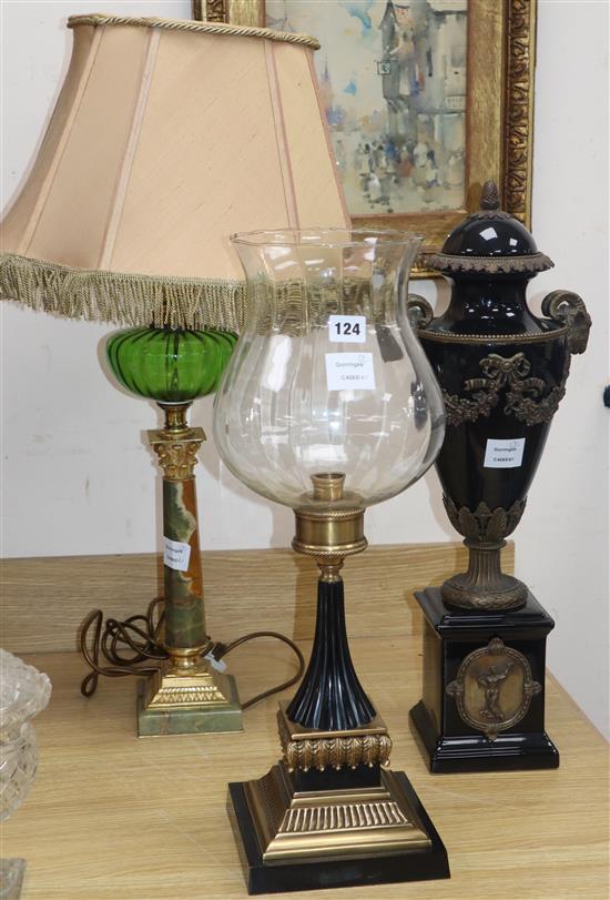 A Victorian style oil lamp, a candlestick with storm shade and a faux marble and gilt metal urn (3)